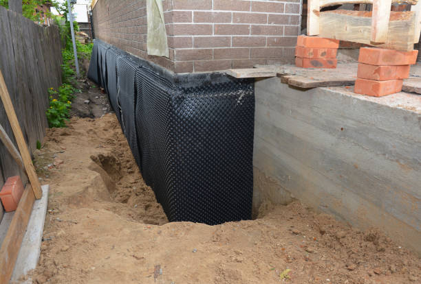 Happy homeowners after waterproofing job in Strawberry Plains